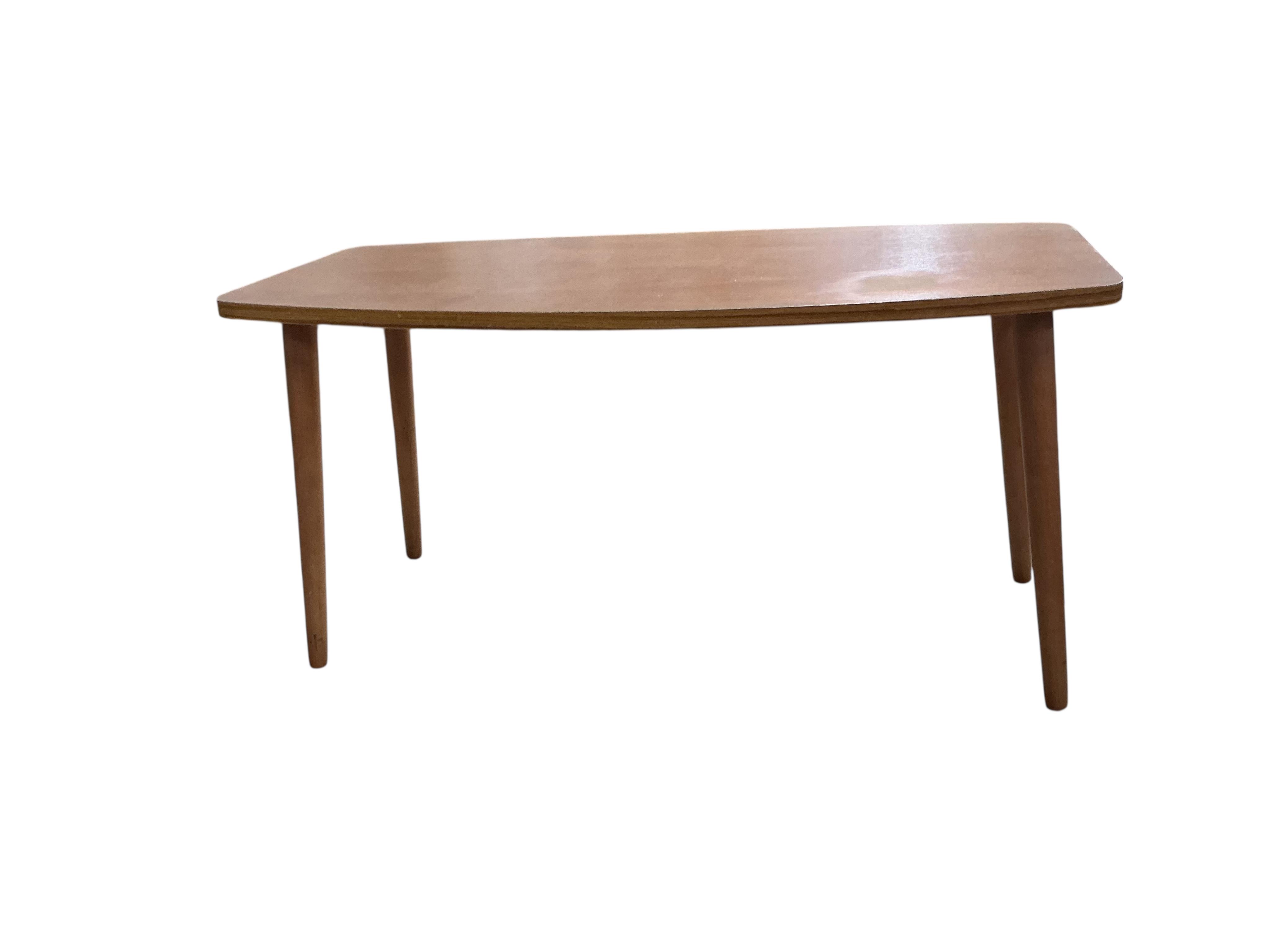 A nest of three mid century Nathan teak tea tables, width 52cm, depth 48cm, height 50cm together with a mid century teak coffee table